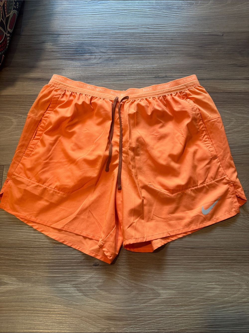 Nike Orange Athletic Running Shorts with Reflective Swoosh